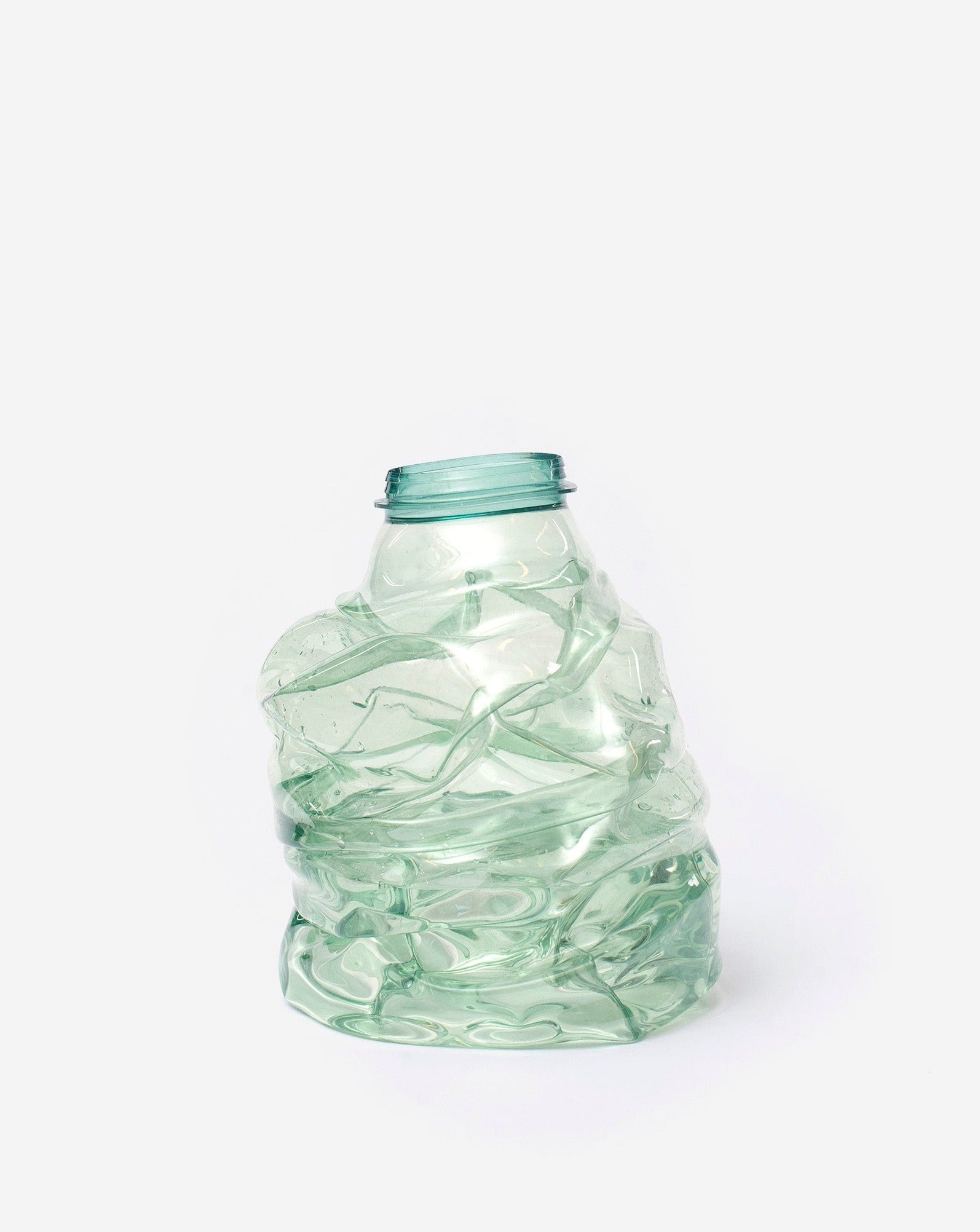 Small green handmade recycled plastic vase on white background