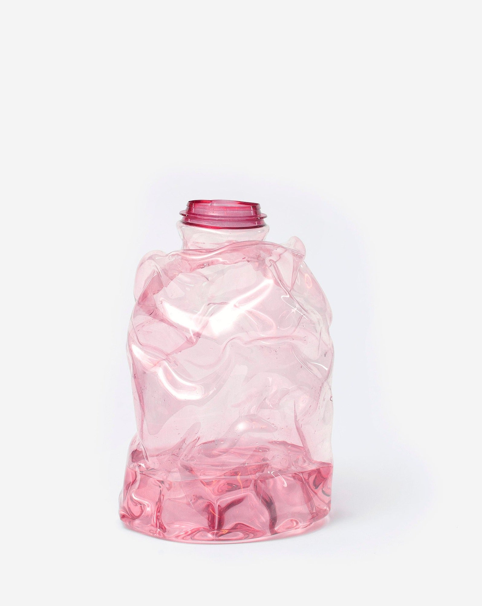 Large pink handmade recycled plastic vase on white background