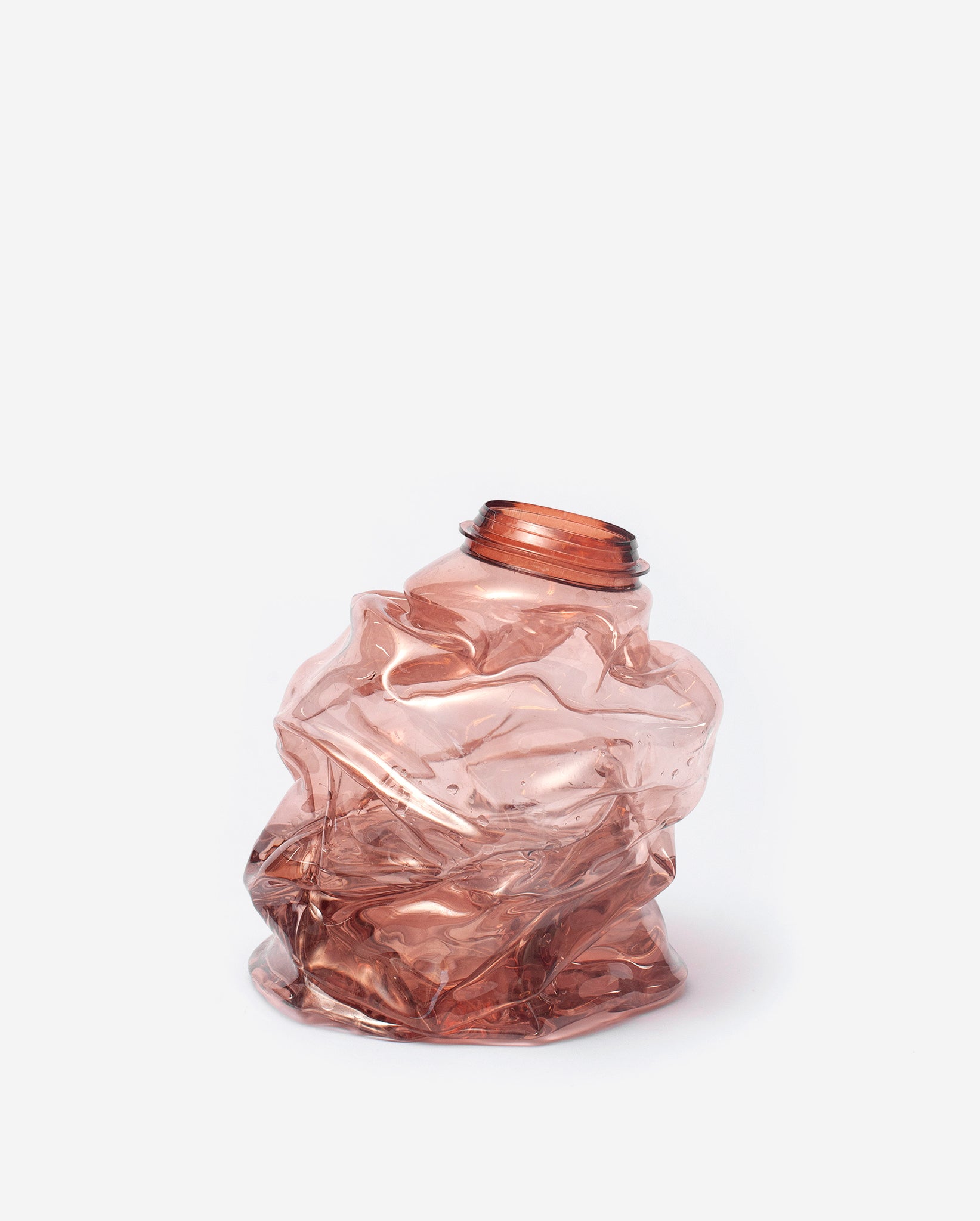 Small brown handmade recycled plastic vase on a white background
