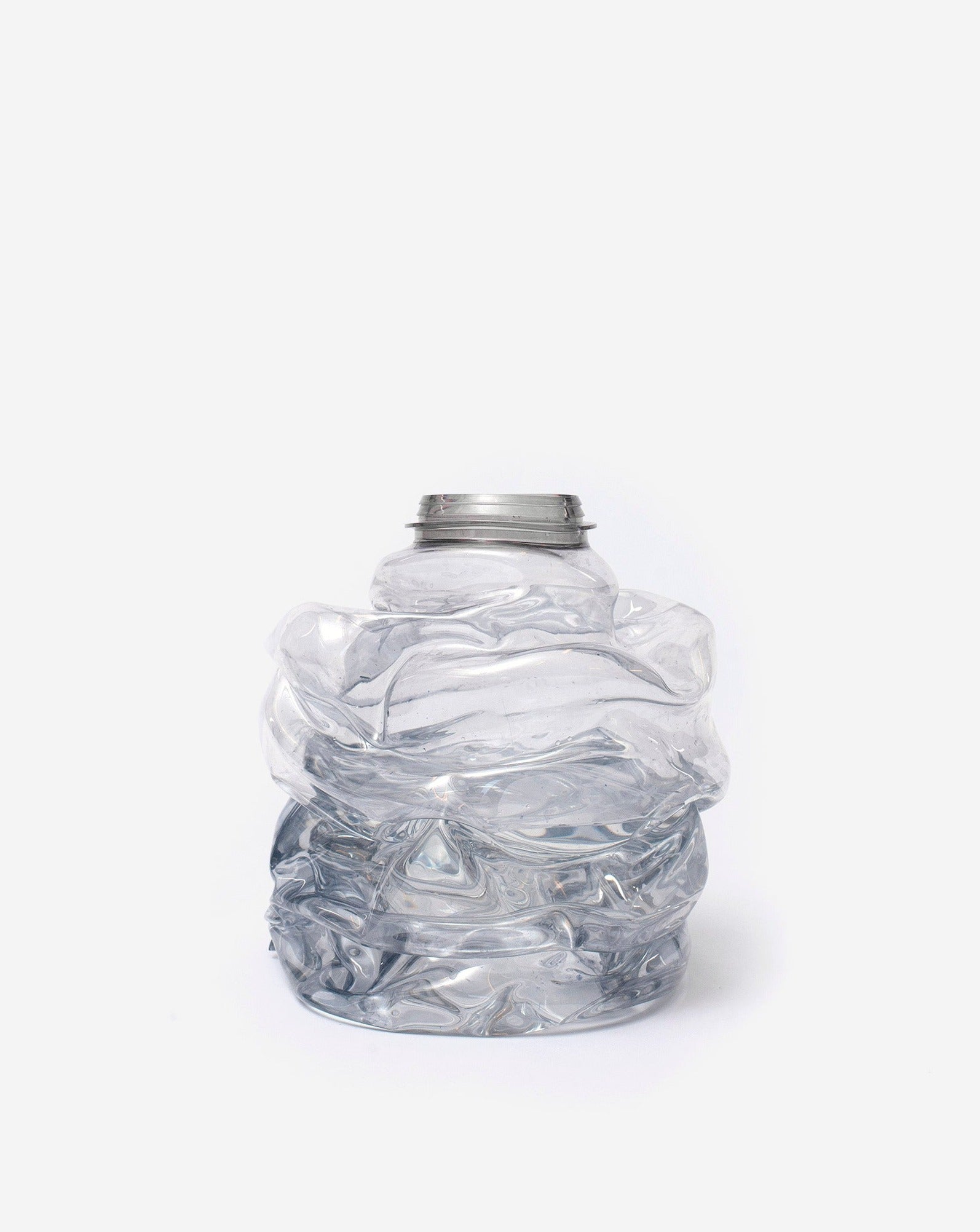 Small blue handmade recycled plastic vase on white background