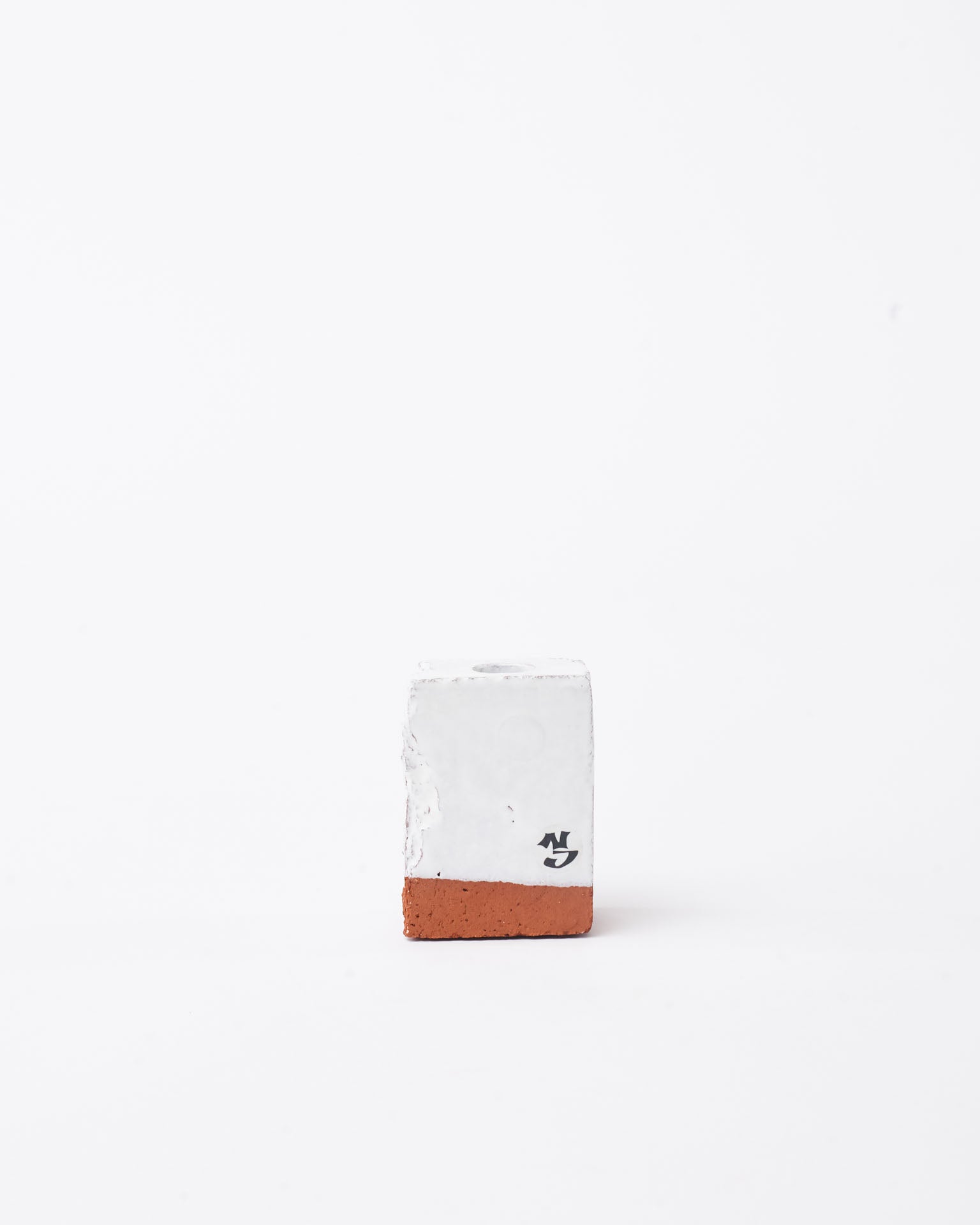 Handmade white brick ceramic candle holder small in white background
