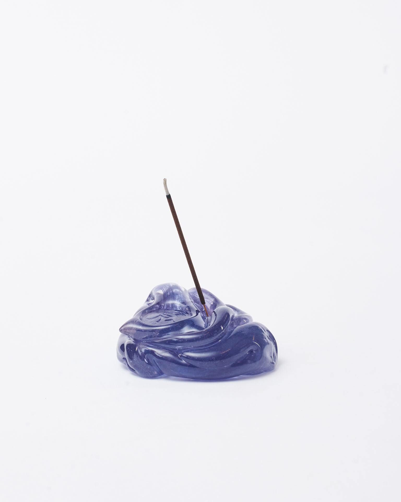 Handmade glass incense holder purple with an incense in white background