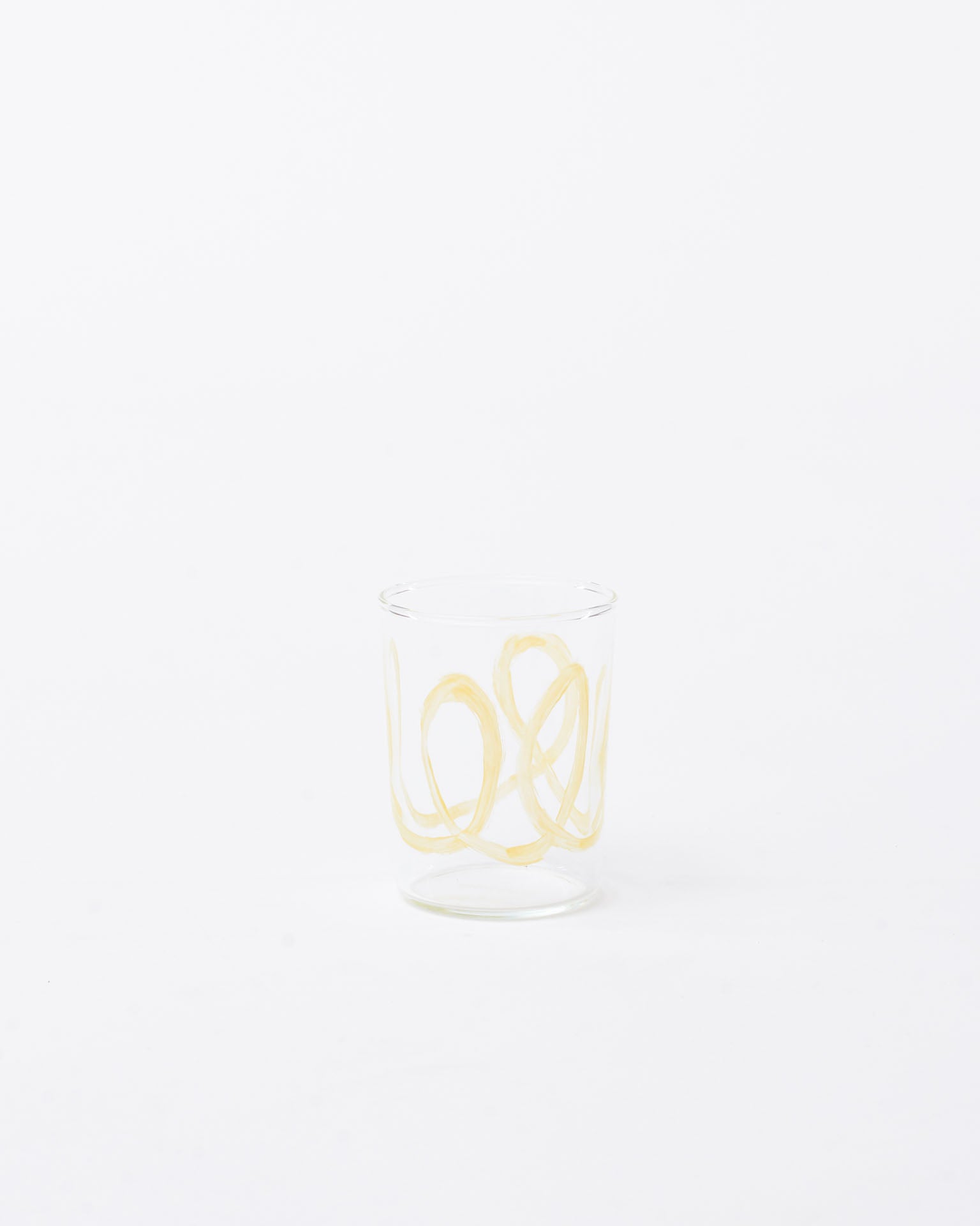 Glass yellow swirl design in white background 