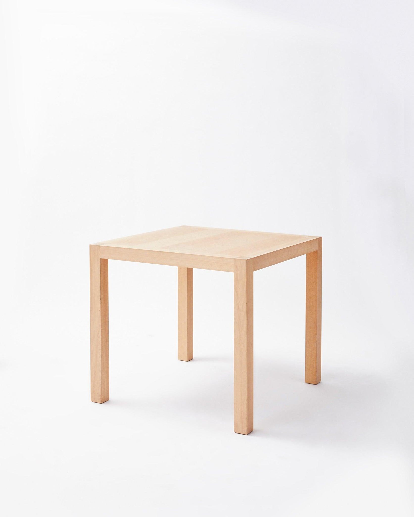 Handmade in denmark table in inclined position on white background