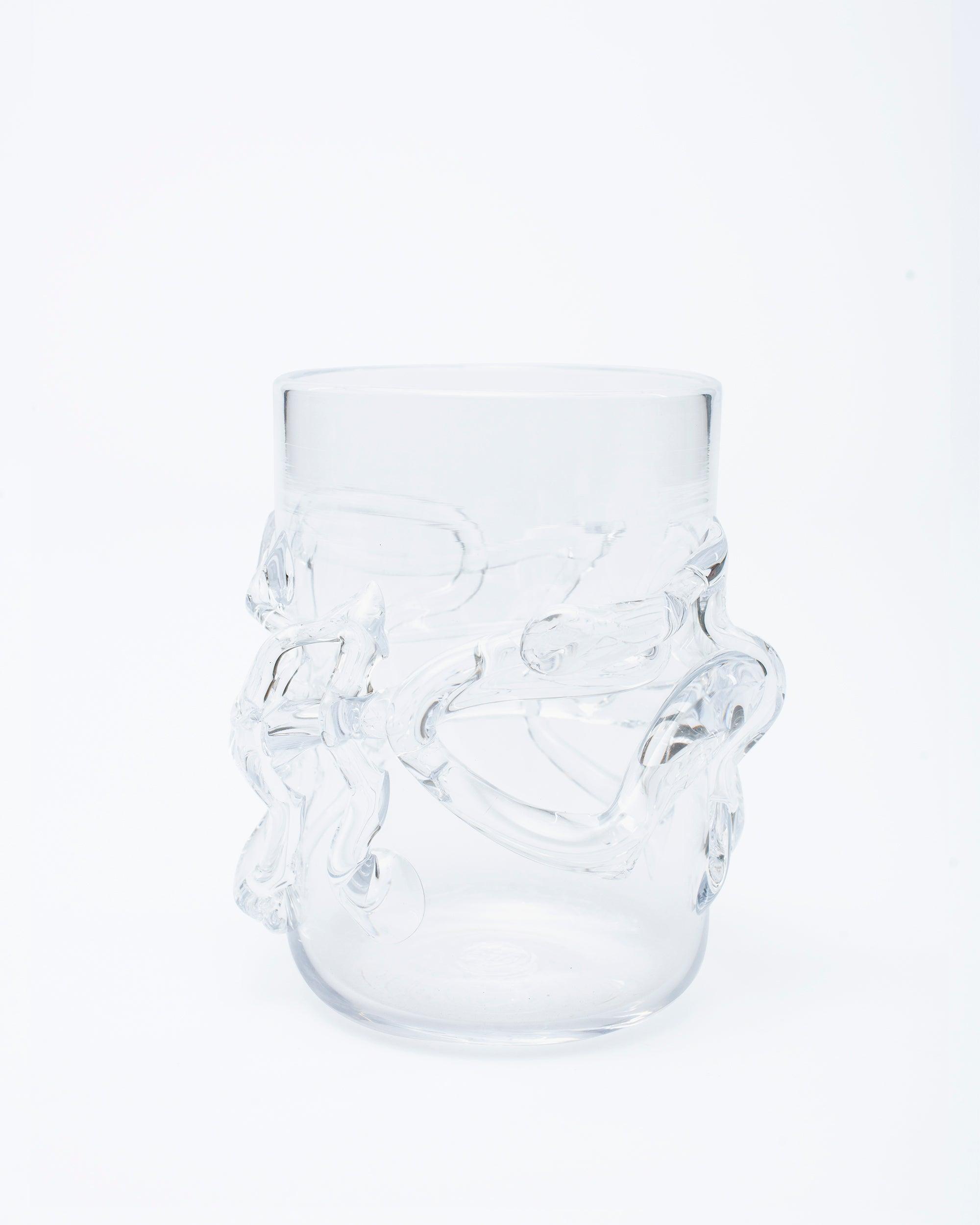 Designer glass vase with melted glass details on white background