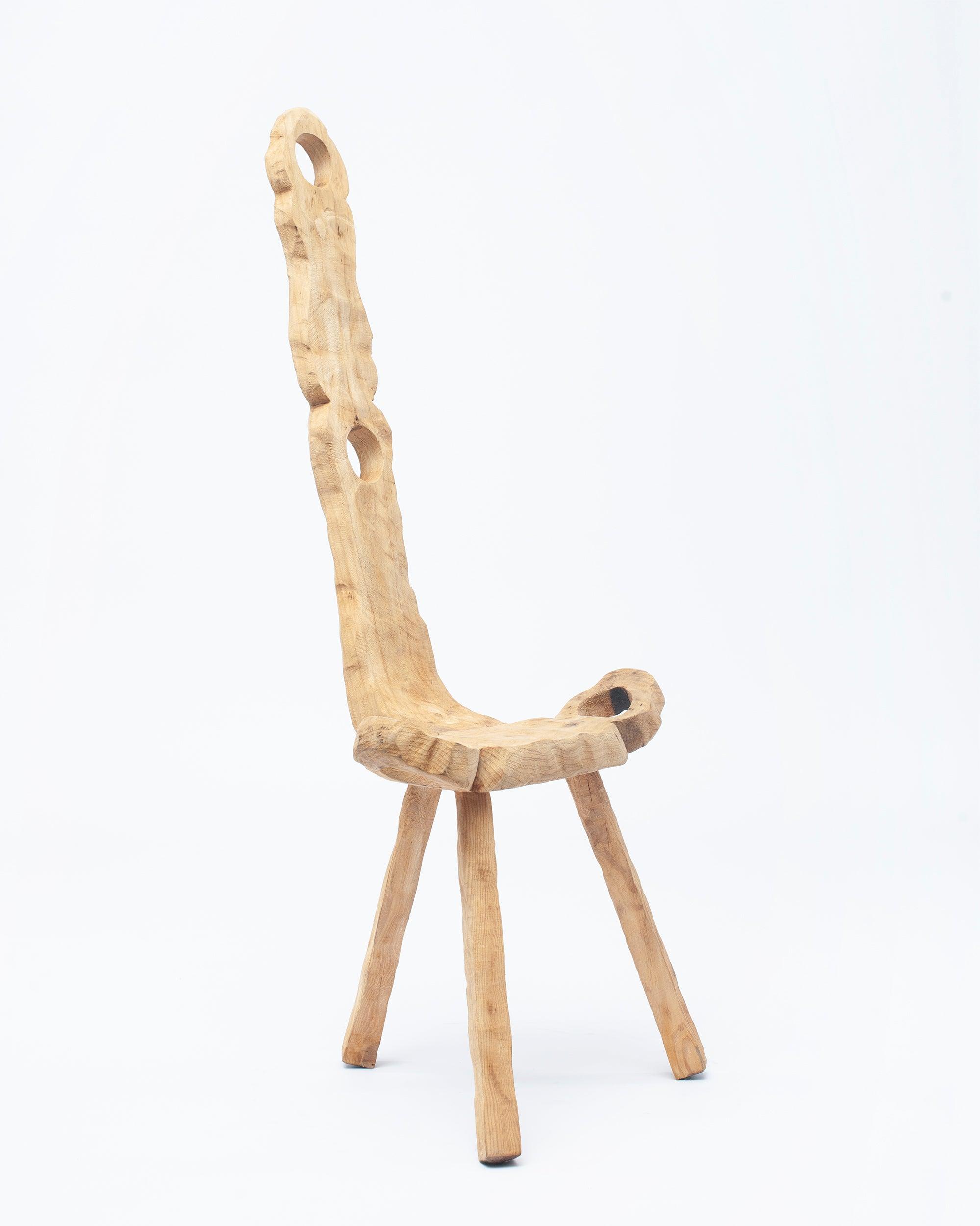 Hand-carved wooden collectible chair by NIKO JUNE studio image in white background