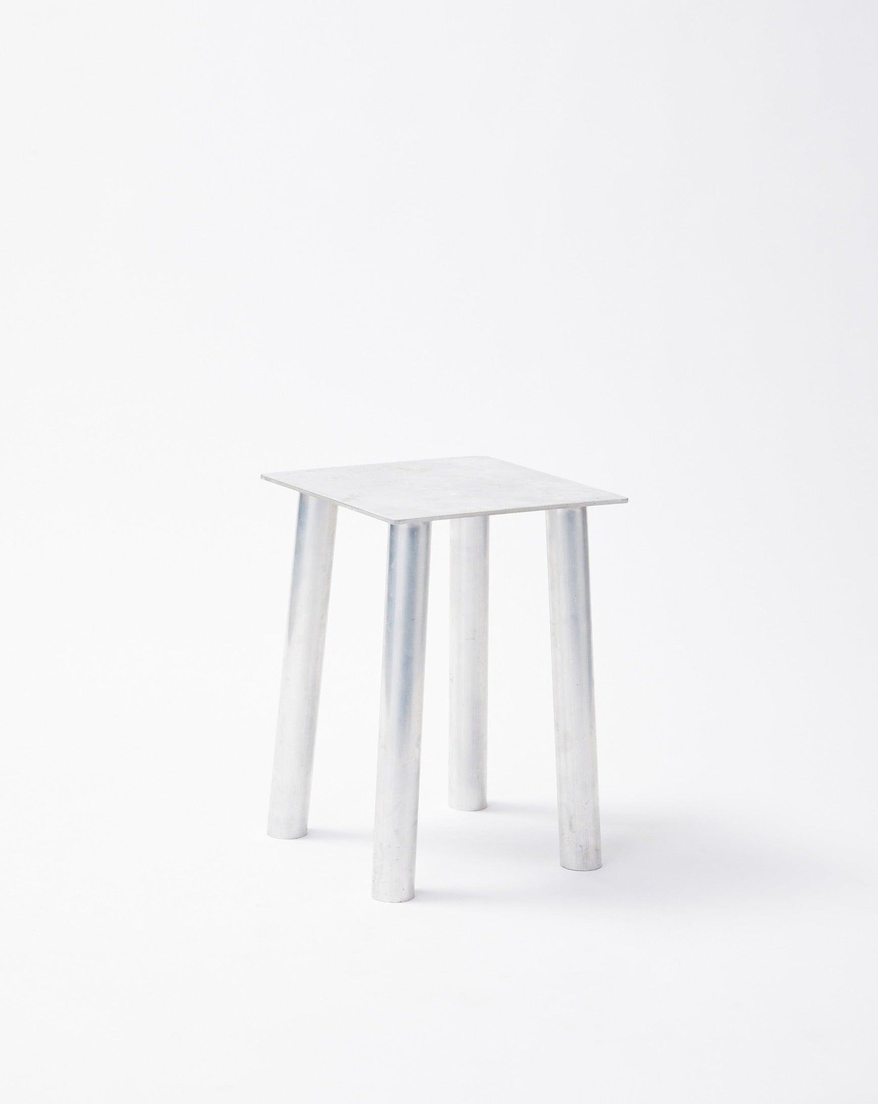 Aluminum decorative stool P-L series lying diagonally to the left