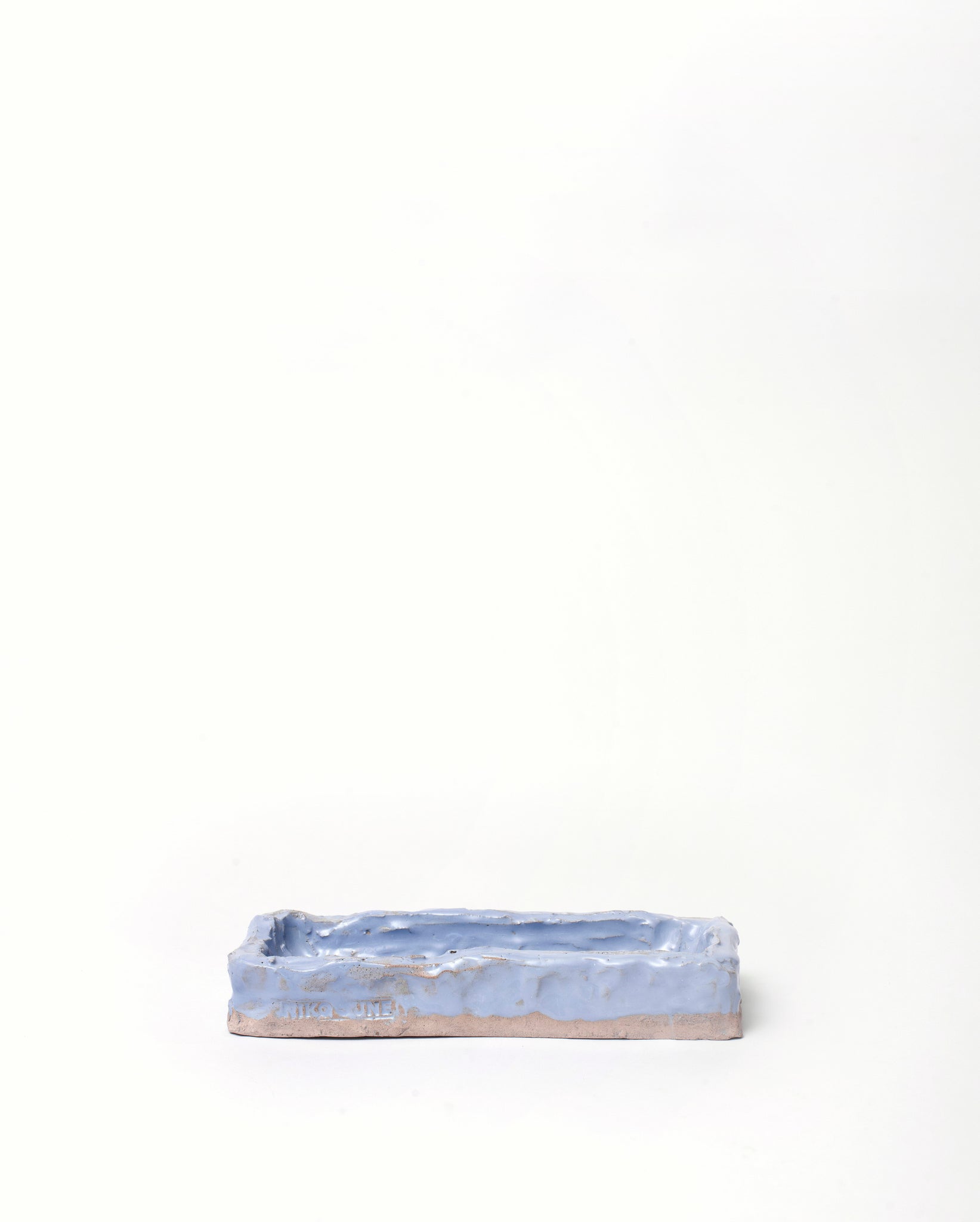 Handmade ceramic organizer object blue in horizontal position white background